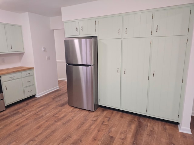 51 Glenerie Ln, Saugerties, NY 12477 - kitchen featuring freestanding refrigerator, wood finished floors, and baseboards