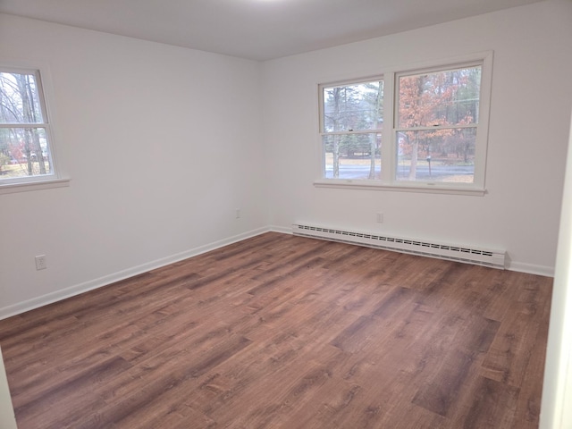 51 Glenerie Ln, Saugerties, NY 12477 - empty room featuring a baseboard heating unit, wood finished floors, and baseboards