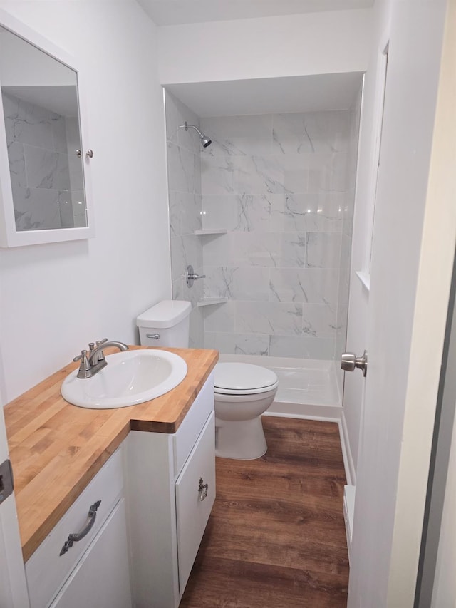 51 Glenerie Ln, Saugerties, NY 12477 - bathroom with vanity, toilet, wood finished floors, and a marble finish shower
