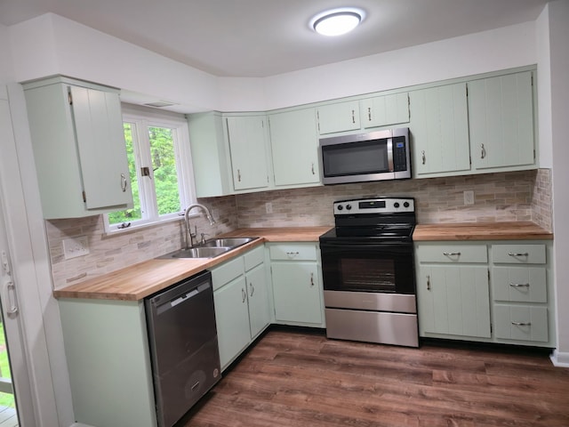51 Glenerie Ln, Saugerties, NY 12477 - kitchen featuring stainless steel appliances, a sink, butcher block counters, dark wood-type flooring, and backsplash