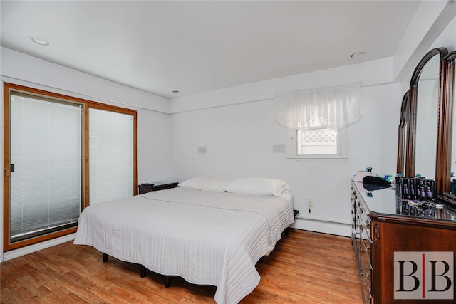 2394 National Dr, Brooklyn, NY 11234 - bedroom with a baseboard radiator and wood finished floors