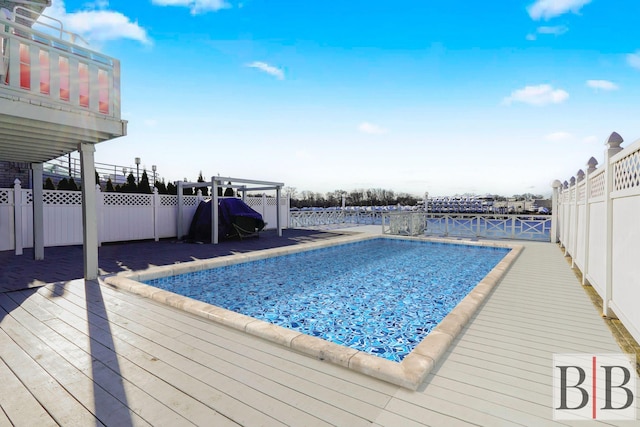 2394 National Dr, Brooklyn, NY 11234 - outdoor pool featuring a fenced backyard and a wooden deck