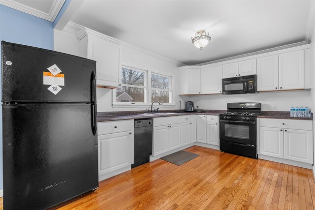 24 Patricia Ln, Washingtonville, NY 10992 - kitchen with a sink, ornamental molding, black appliances, and dark countertops