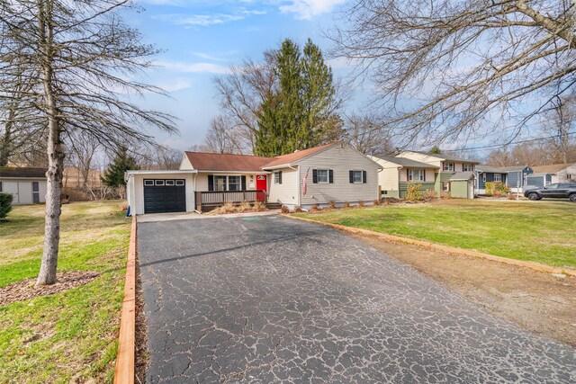 24 Patricia Ln, Washingtonville, NY 10992 - ranch-style house featuring driveway, a front yard, and a garage