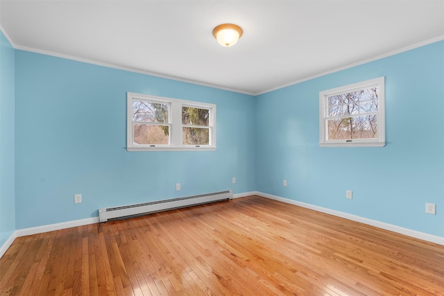 24 Patricia Ln, Washingtonville, NY 10992 - spare room featuring plenty of natural light, baseboards, baseboard heating, and hardwood / wood-style flooring