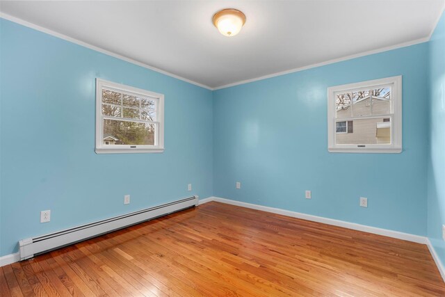 24 Patricia Ln, Washingtonville, NY 10992 - empty room with wood-type flooring, crown molding, baseboards, and a baseboard heating unit