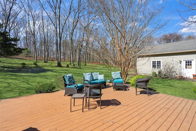 wooden terrace with a lawn and an outdoor hangout area