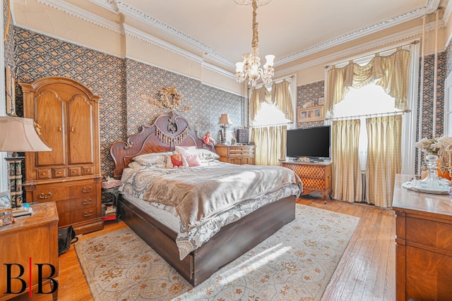 22 4th Pl, Brooklyn, NY 11231 - bedroom with wallpapered walls, ornamental molding, a notable chandelier, and light wood-type flooring