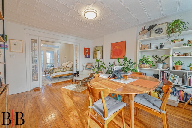 22 4th Pl, Brooklyn, NY 11231 - dining space featuring light wood finished floors, an ornate ceiling, and french doors