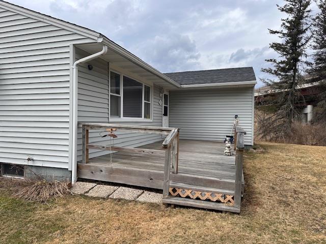 exterior space featuring a yard and a deck
