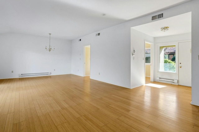 unfurnished living room with a chandelier, light wood-style floors, visible vents, and a baseboard heating unit