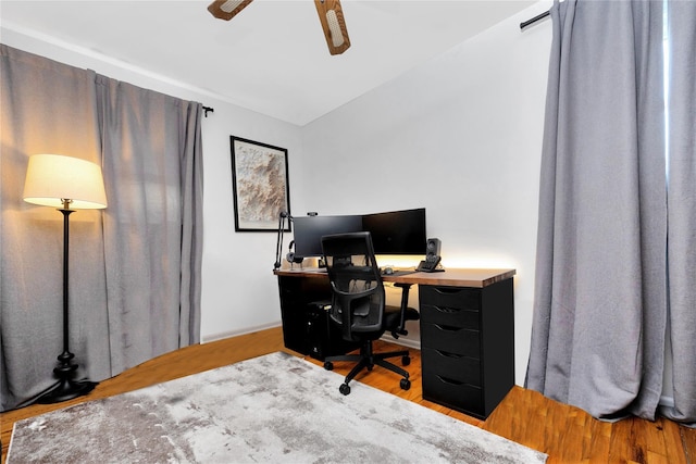 office area with wood finished floors and ceiling fan
