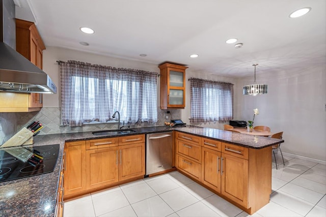 kitchen featuring a sink, wall chimney exhaust hood, a peninsula, stainless steel dishwasher, and black electric stovetop