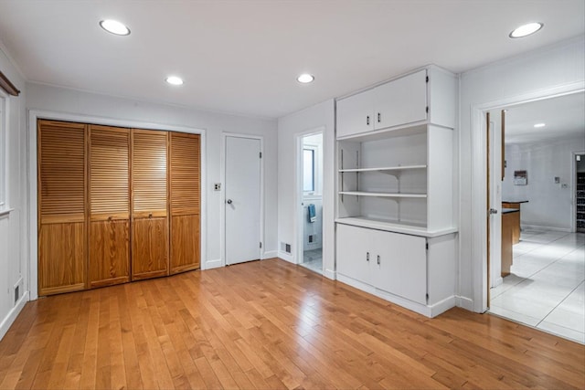 entryway featuring light wood-style floors and recessed lighting