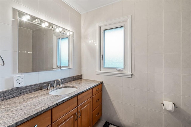 bathroom with tile walls and vanity