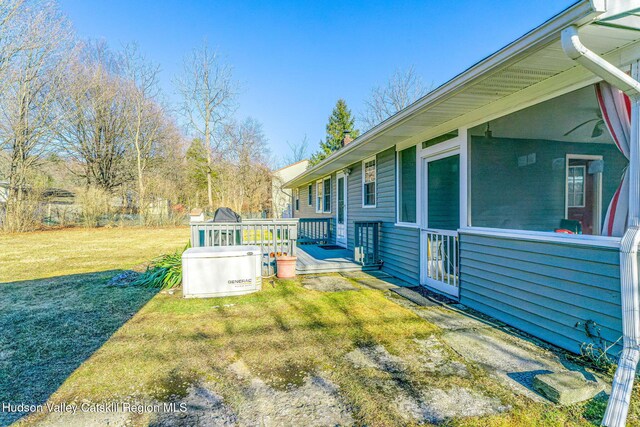 view of yard featuring a wooden deck