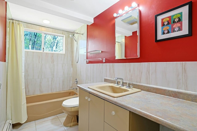 bathroom featuring vanity, toilet, baseboard heating, tile patterned floors, and shower / tub combo