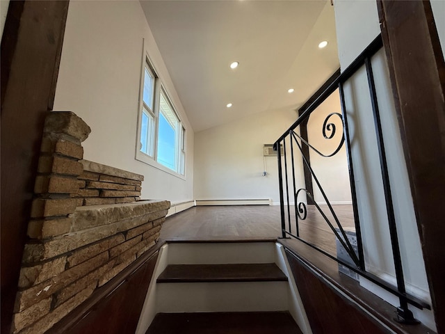 stairs featuring vaulted ceiling, wood finished floors, and recessed lighting