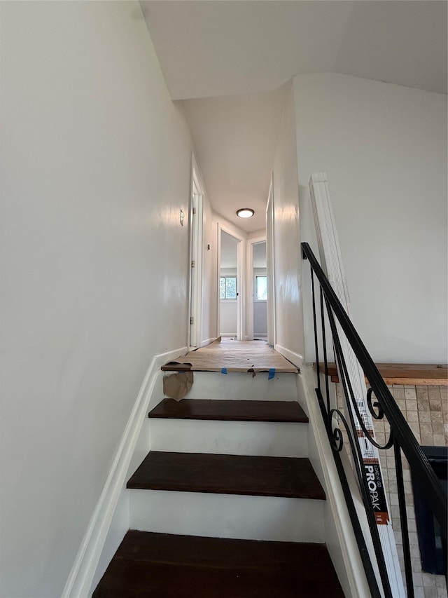 stairs with wood finished floors
