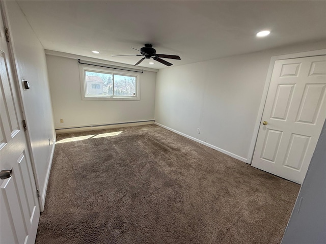 unfurnished bedroom featuring a baseboard heating unit, baseboards, carpet, recessed lighting, and ceiling fan