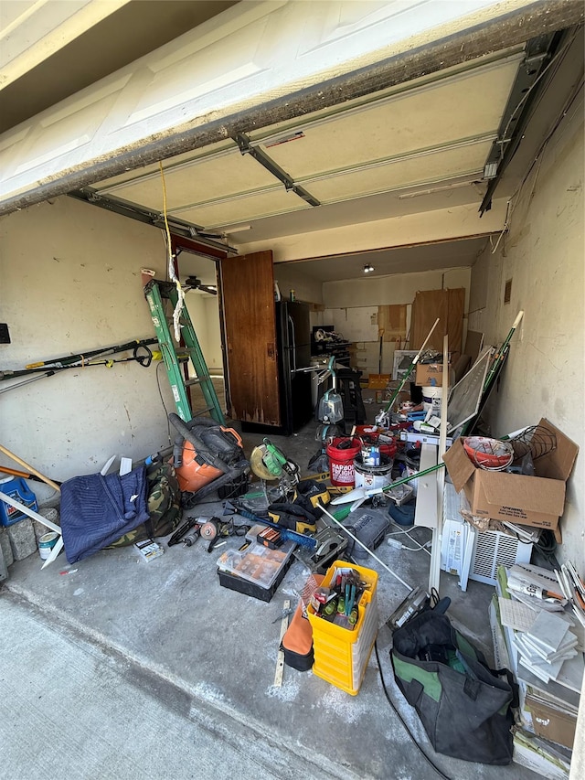 garage with freestanding refrigerator