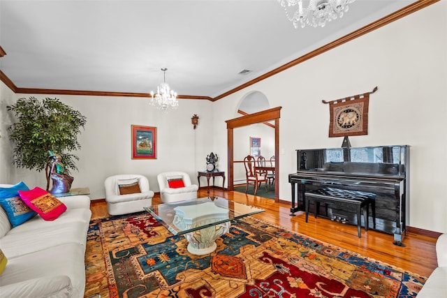5 Peterson Rd, Monroe, NY 10950 - living room with a chandelier, wood finished floors, ornamental molding, and baseboards