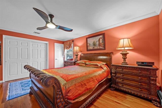 5 Peterson Rd, Monroe, NY 10950 - bedroom featuring crown molding, wood finished floors, a baseboard radiator, and ceiling fan