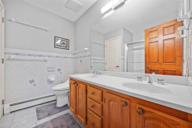 5 Peterson Rd, Monroe, NY 10950 - full bath with baseboard heating, a stall shower, double vanity, toilet, and tile walls