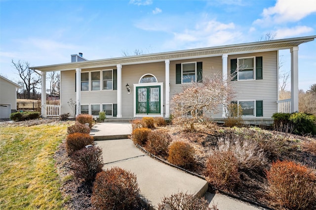 5 Peterson Rd, Monroe, NY 10950 - bi-level home with a porch and a chimney
