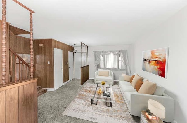 3317 Gunther Ave, Bronx, NY 10469 - living area featuring wood walls, baseboards, carpet flooring, and stairs