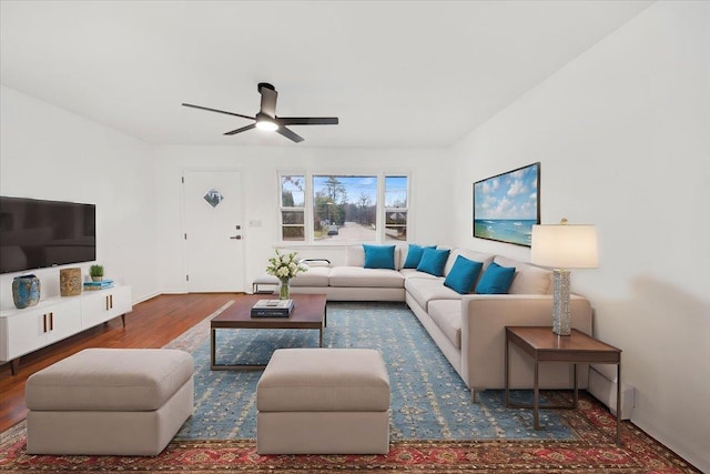 living area featuring ceiling fan and wood finished floors