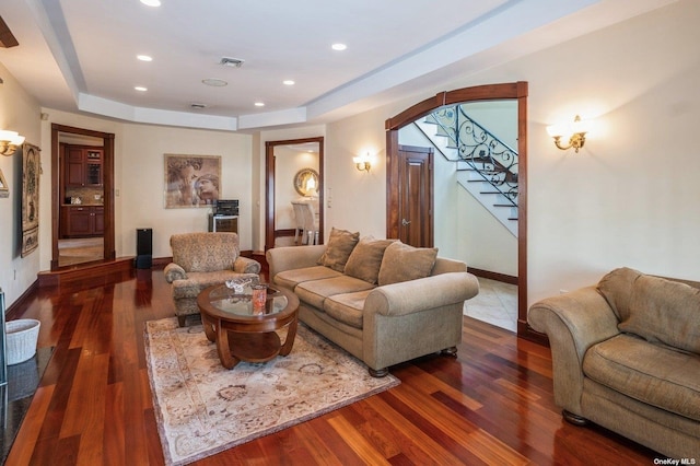 37-12 222nd St, Bayside, NY 11361 - living room featuring stairs, visible vents, wood finished floors, and a raised ceiling