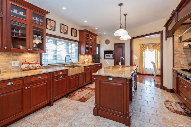 37-12 222nd St, Bayside, NY 11361 - kitchen featuring a sink, a healthy amount of sunlight, and tasteful backsplash