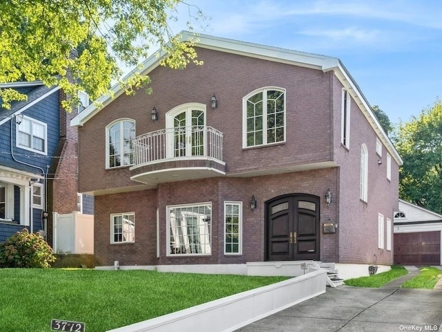 37-12 222nd St, Bayside, NY 11361 - view of front of property featuring fence, french doors, a balcony, a front lawn, and brick siding