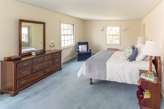 bedroom with carpet floors and baseboards