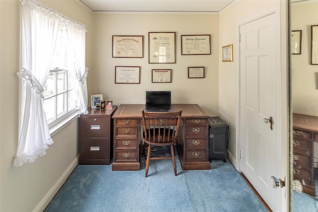 home office with carpet flooring, baseboards, and crown molding