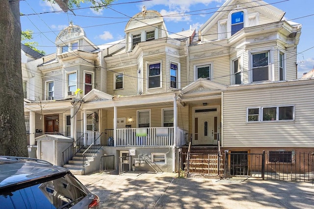 2263 Ryer Ave, Bronx, NY 10457 - multi unit property with a fenced front yard and covered porch