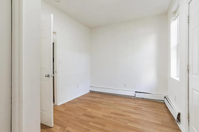 2263 Ryer Ave, Bronx, NY 10457 - unfurnished room featuring light wood finished floors and baseboard heating