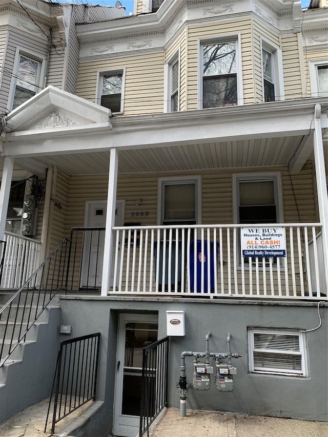 2263 Ryer Ave, Bronx, NY 10457 - exterior space with covered porch and stucco siding