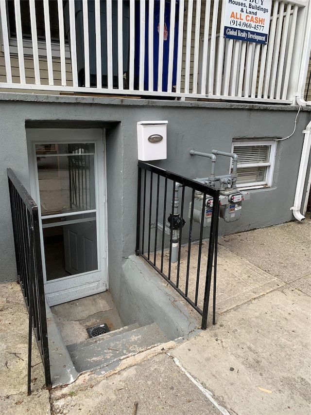 2263 Ryer Ave, Bronx, NY 10457 - doorway to property featuring stucco siding