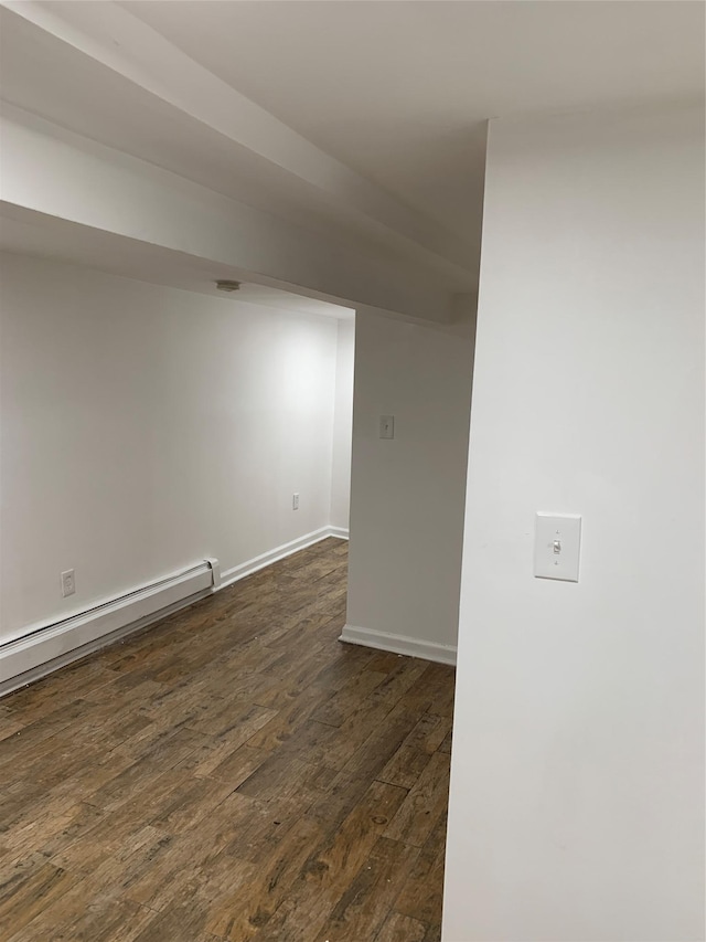 2263 Ryer Ave, Bronx, NY 10457 - empty room with dark wood finished floors, a baseboard radiator, and baseboards