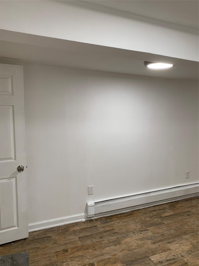 2263 Ryer Ave, Bronx, NY 10457 - spare room featuring baseboards, a baseboard heating unit, and dark wood finished floors