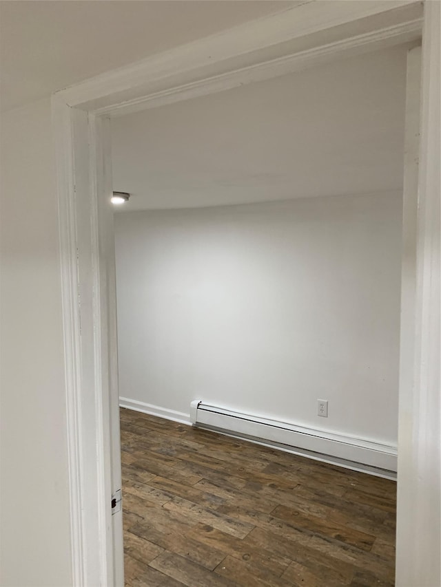 2263 Ryer Ave, Bronx, NY 10457 - spare room featuring a baseboard radiator, baseboards, and wood-type flooring