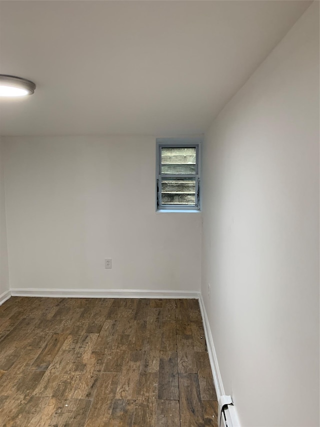 2263 Ryer Ave, Bronx, NY 10457 - spare room featuring baseboards, wood finished floors, and baseboard heating