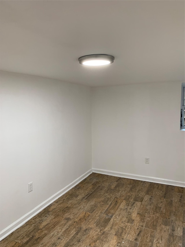 2263 Ryer Ave, Bronx, NY 10457 - unfurnished room with dark wood finished floors and baseboards