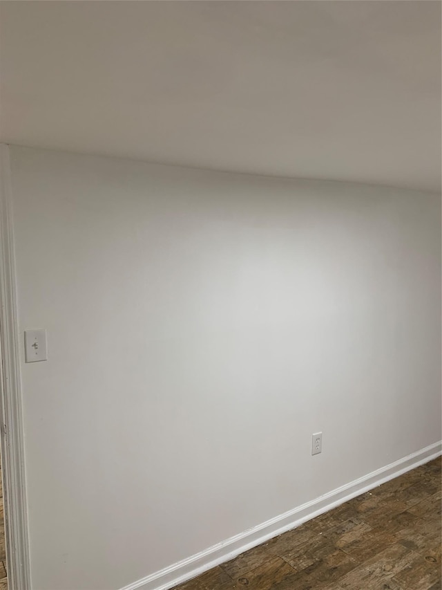 2263 Ryer Ave, Bronx, NY 10457 - unfurnished room with baseboards and dark wood-style flooring