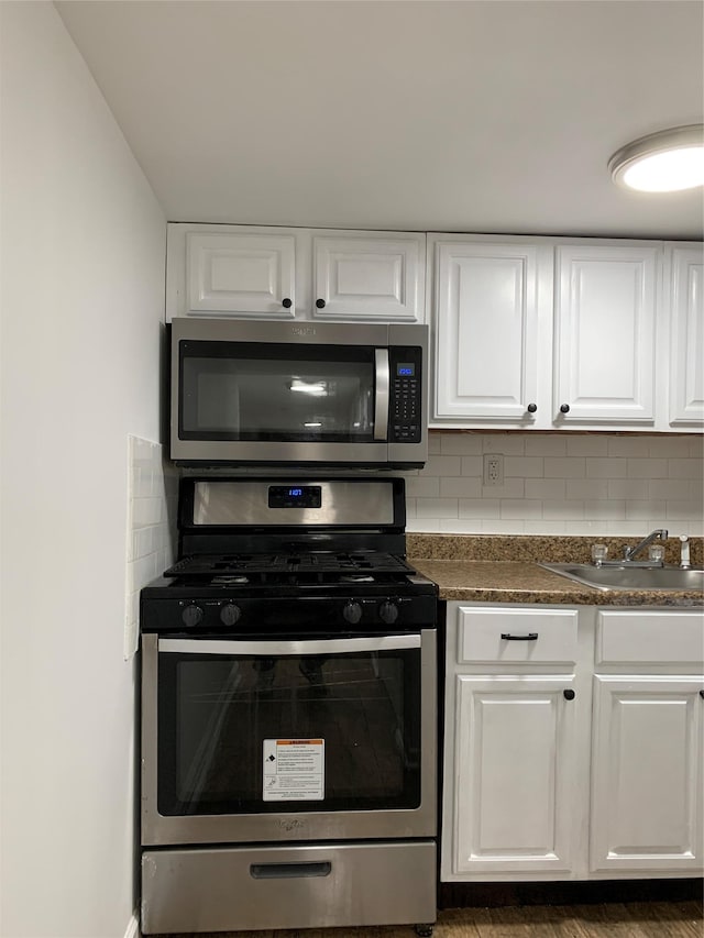 2263 Ryer Ave, Bronx, NY 10457 - kitchen featuring backsplash, a sink, and stainless steel appliances