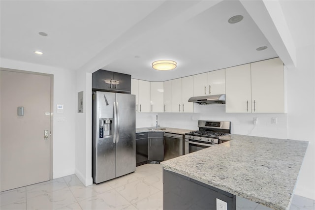 45-16 83rd Rd Unit E6J, Elmhurst, NY 11373 - kitchen with a peninsula, under cabinet range hood, marble finish floor, and stainless steel appliances