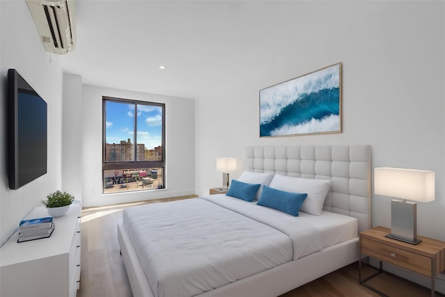 45-16 83rd Rd Unit E6J, Elmhurst, NY 11373 - bedroom featuring recessed lighting, a wall unit AC, and wood finished floors