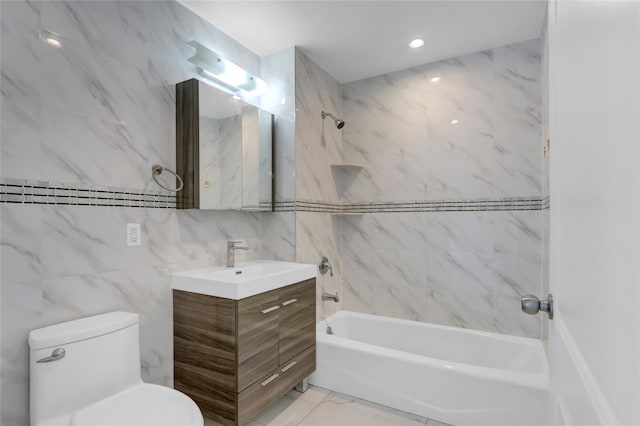 45-16 83rd Rd Unit E6J, Elmhurst, NY 11373 - bathroom with toilet, tile walls,  shower combination, vanity, and marble finish floor